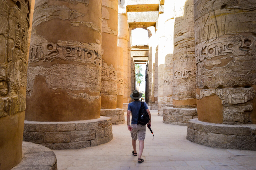 young man walking egyptian temple 2