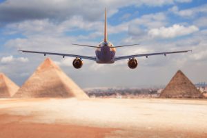Commercial,Passenger,Plane,Flies,Towards,The,Giza,Pyramids,,Concept,Of